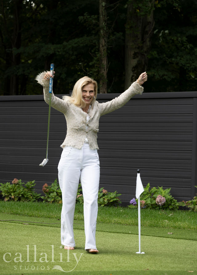 Beth celebrating a putt on the green